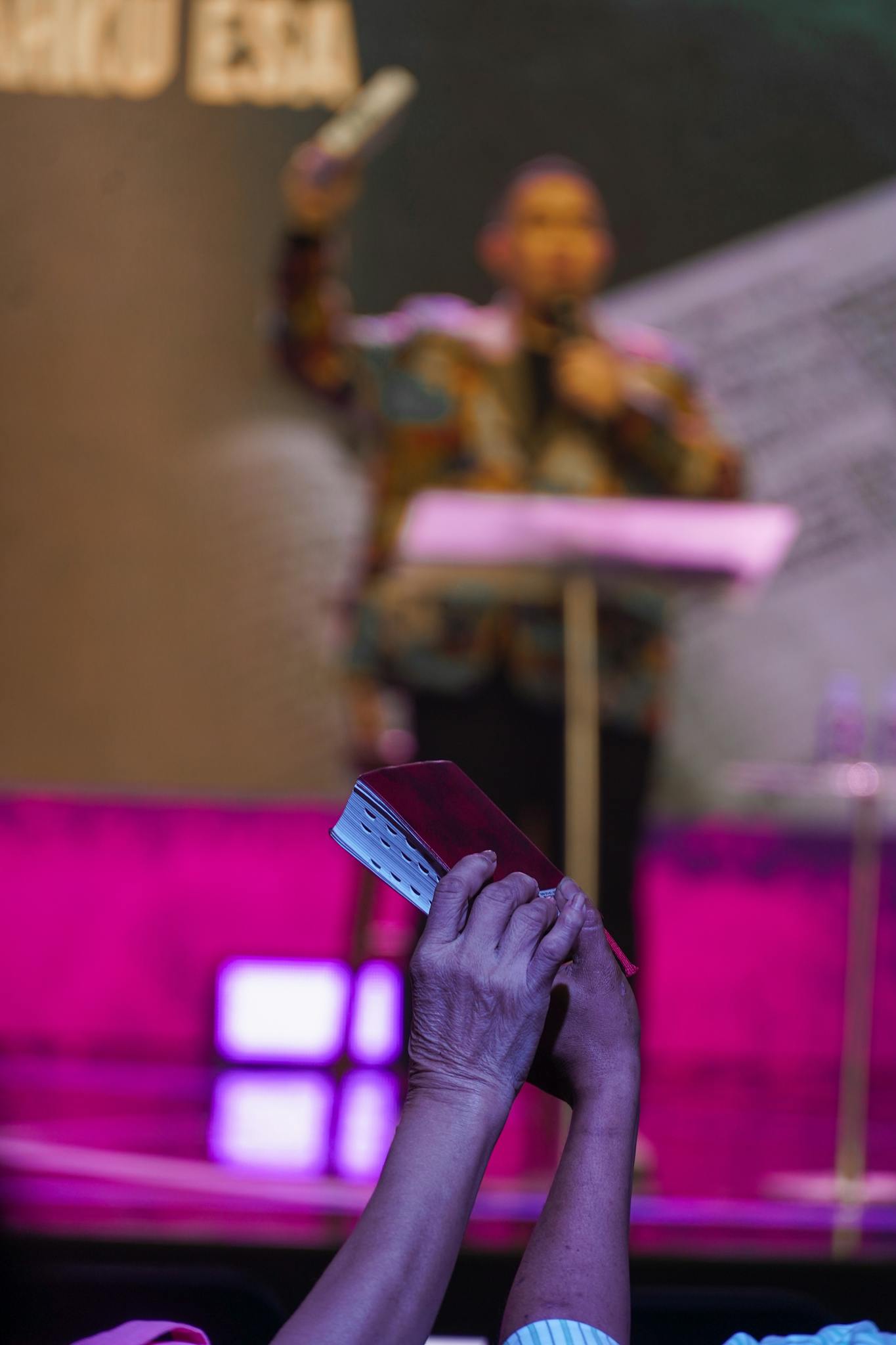 A dynamic church service in Jakarta with a focus on worship and the Bible.